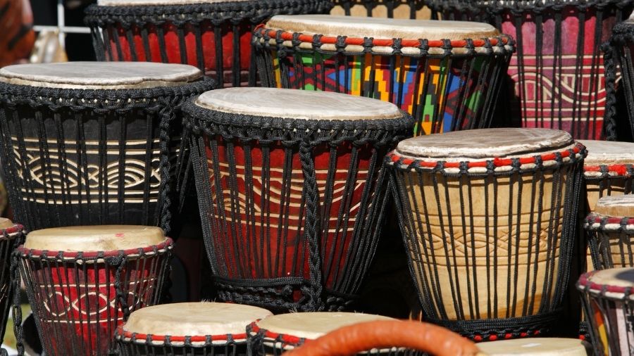 landscape-style view featuring several djembe drums arranged together.
