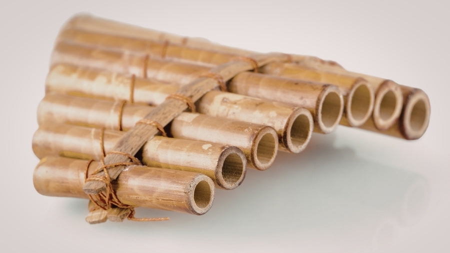 Wooden panpipes on a white background