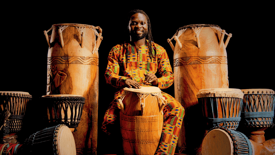 Man playing Kpanlogo Drum