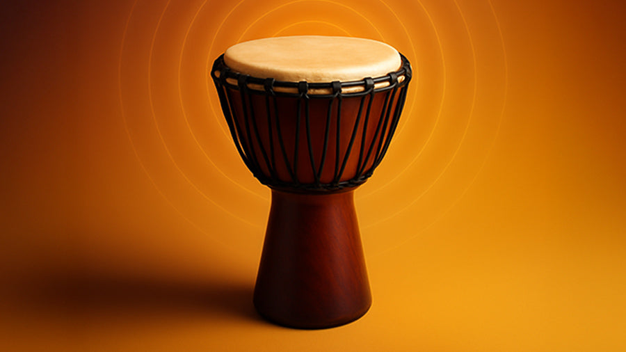 A polished wooden djembe with a natural skin drumhead stands against a vibrant orange gradient background, with subtle glowing concentric sound waves radiating outward to symbolize digital drum sound packs for producers.