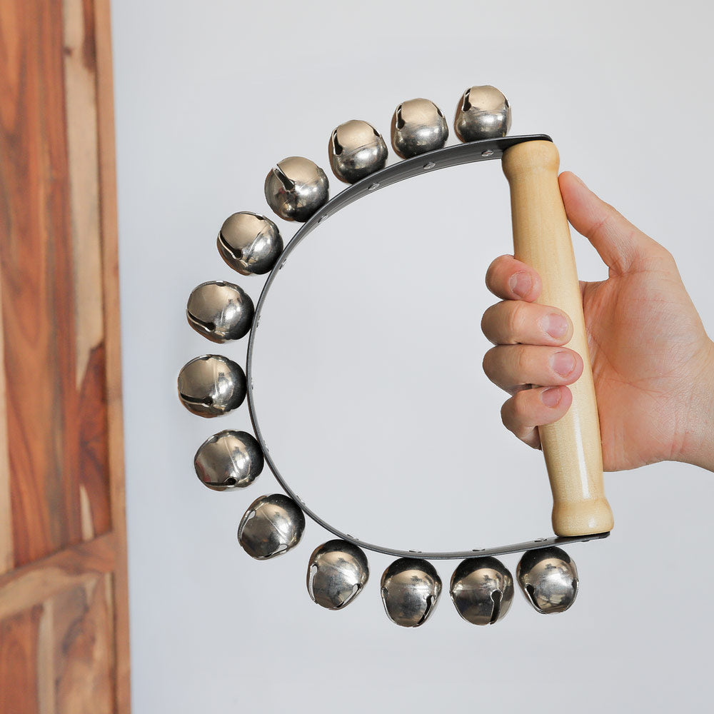 13 bell sleigh bell in hand