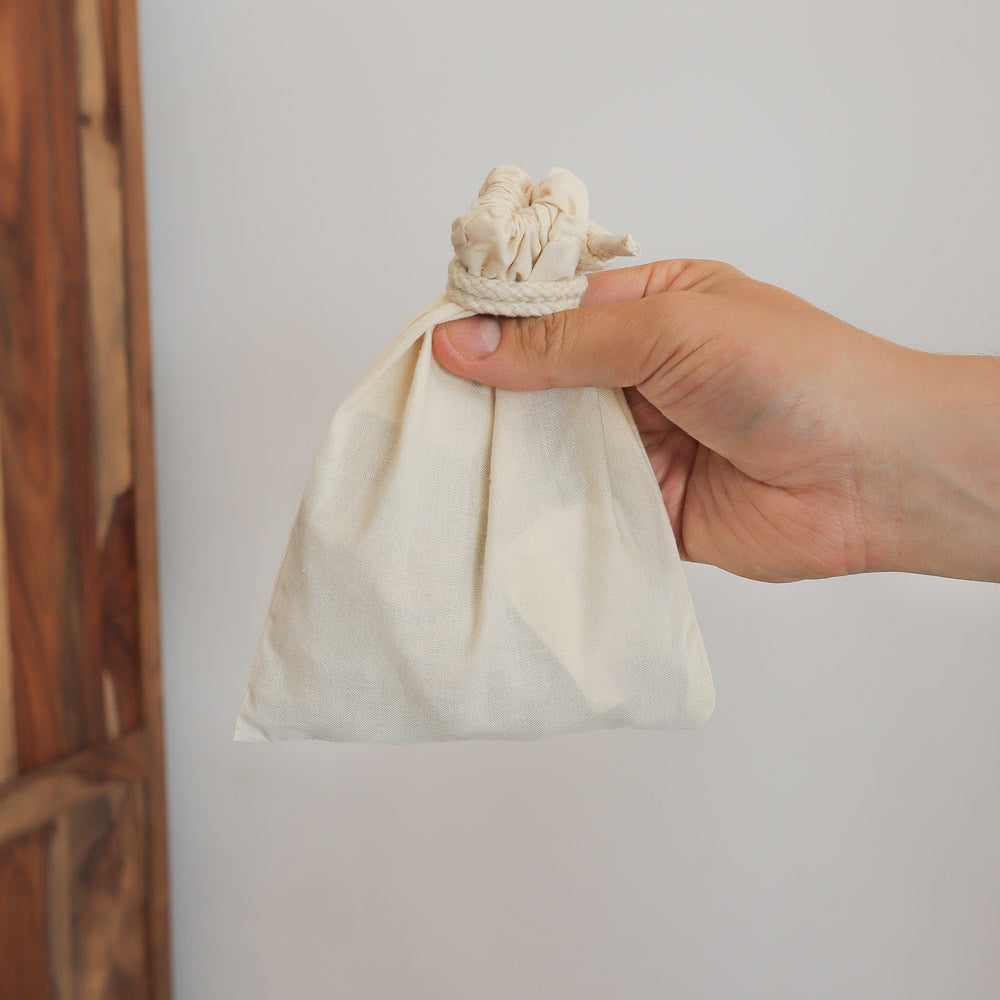 250g tagua seed bag in hand