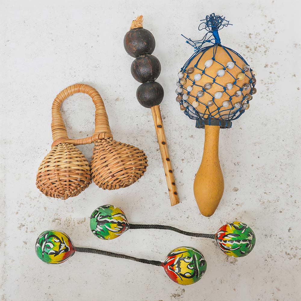 Bundle of traditional African instruments including the double kambala shaker, hosho maraca, gourd cabasa and two painted west african kashaka shakers.