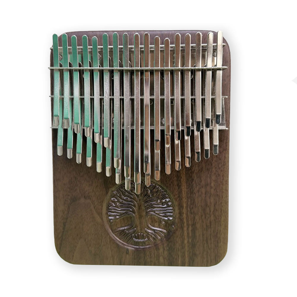 Front view of the Black Walnut Hluru Kalimba with 34 keys on a white background.