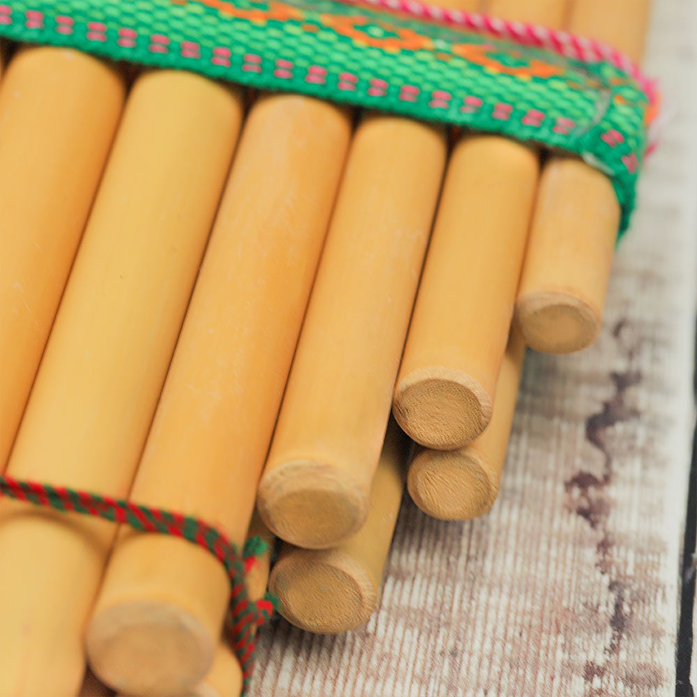Close-up of the bottom of the bamboo Zanpona panpipes showing the sealed ends and how the tubes are attached together.