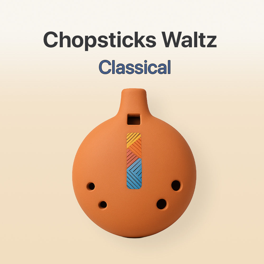 Ceramic ocarina with colorful design on a beige background, labeled 'Chopsticks Waltz Classical'.