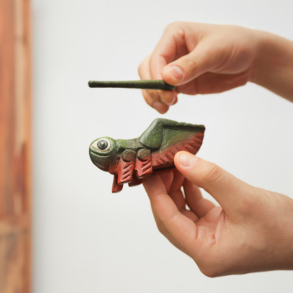 Handheld Cricket Guiro & Stick wooden percussion instrument, crafted from durable wood. Produces rhythmic sounds for creative musical play..