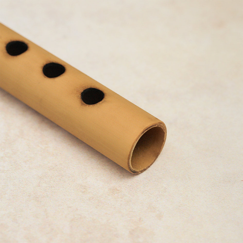 Close-up of the bottom end of a Gamelan suling flute.