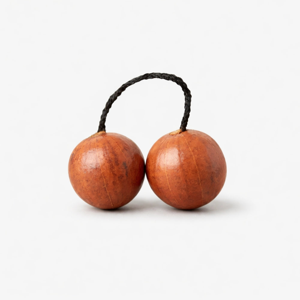 Gourd kashaka shakers on black wax cord professional studio photography