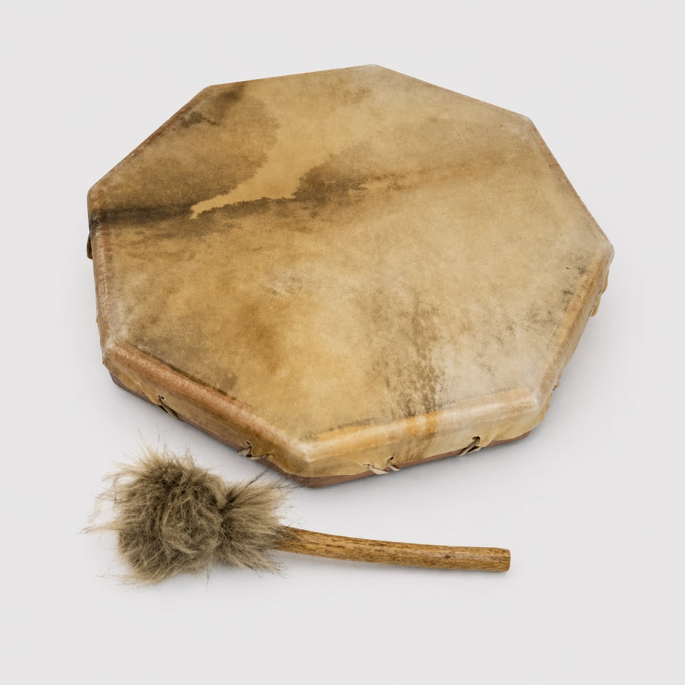 40cm Hexagonal animal hide leather shamanic drum with a mallet beater on a white studio background