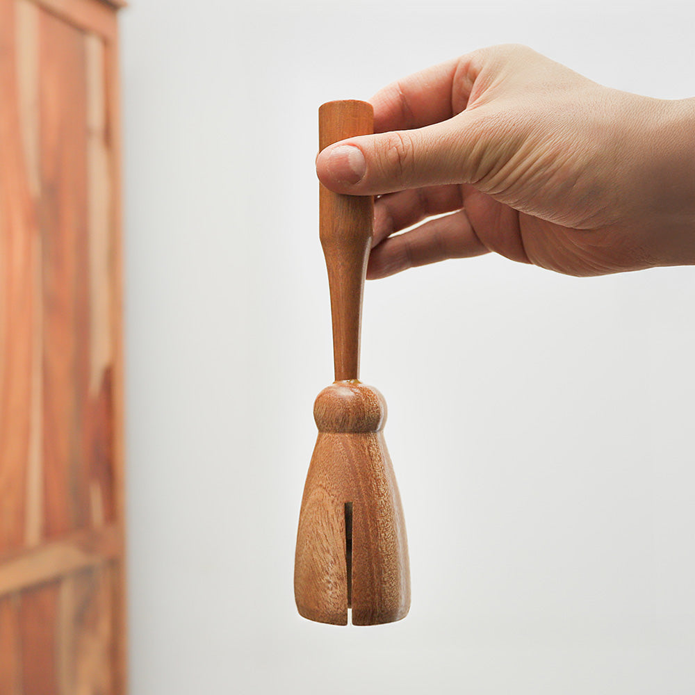 Handcrafted Wooden Monk Bell from India, featuring a metal bar mechanism for a clear, resonant sound. Ideal for sound therapy and creative music.