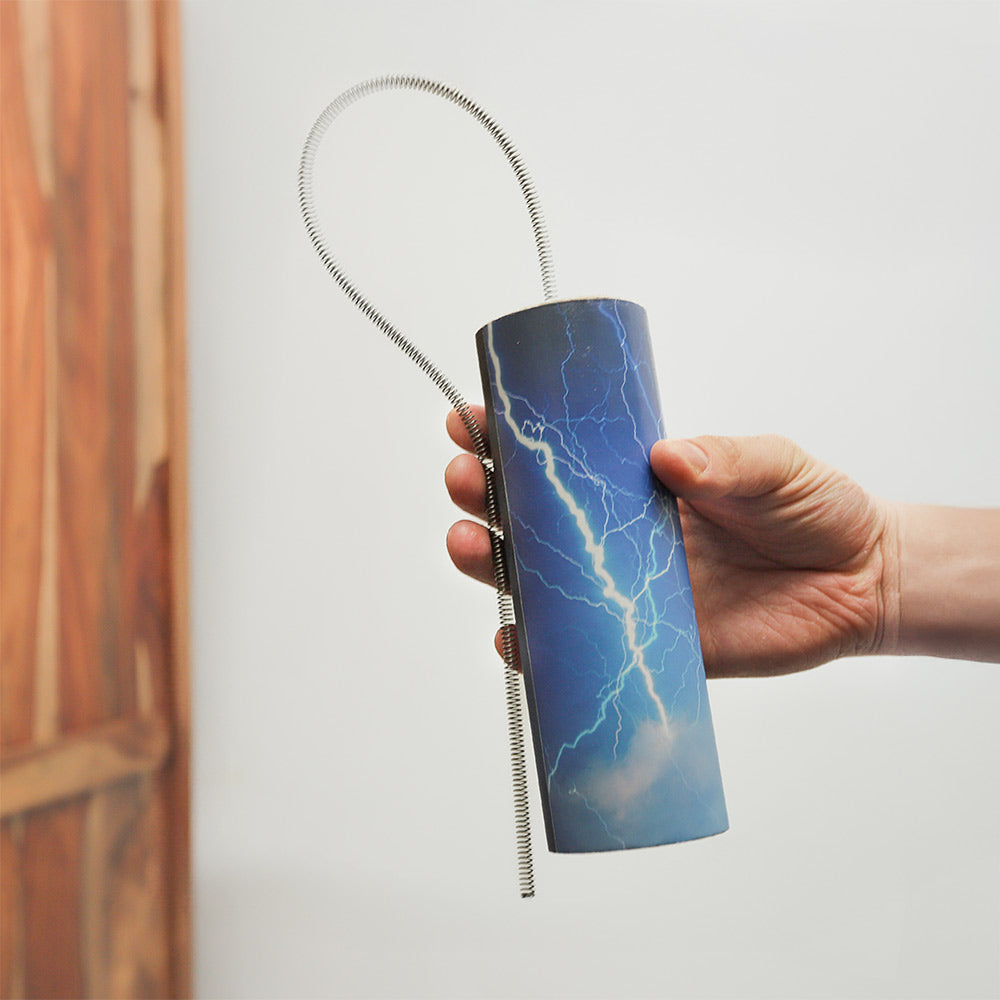 Kanji thunder drum held in hand, showcasing its size and design.