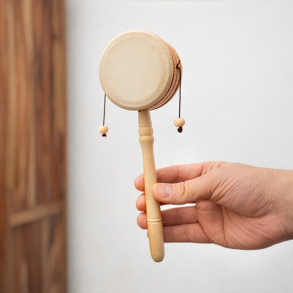 Kolaka Monkey drum held in hand to show its scale.