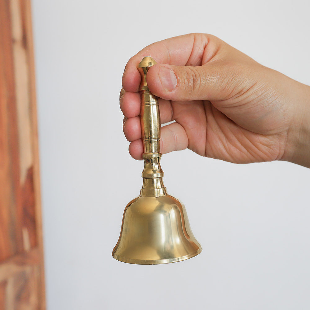 Solid Brass Indian Ghanta Bell Held in hand to show scale size