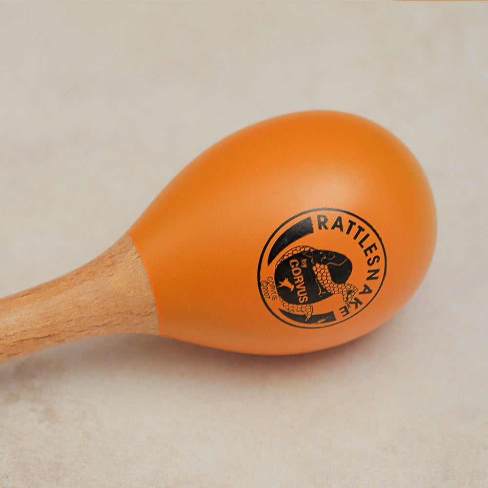 Close-up of the Rattlesnake Percussion maraca shaker, showcasing the Corvus logo clearly on the instrument.