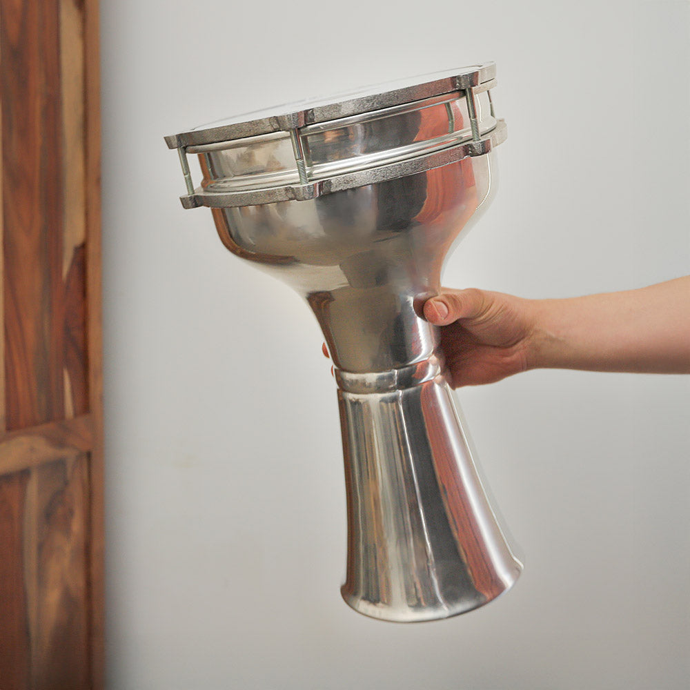 Sawt El Ahram Turkish darbuka held in hand, demonstrating its size and traditional design.