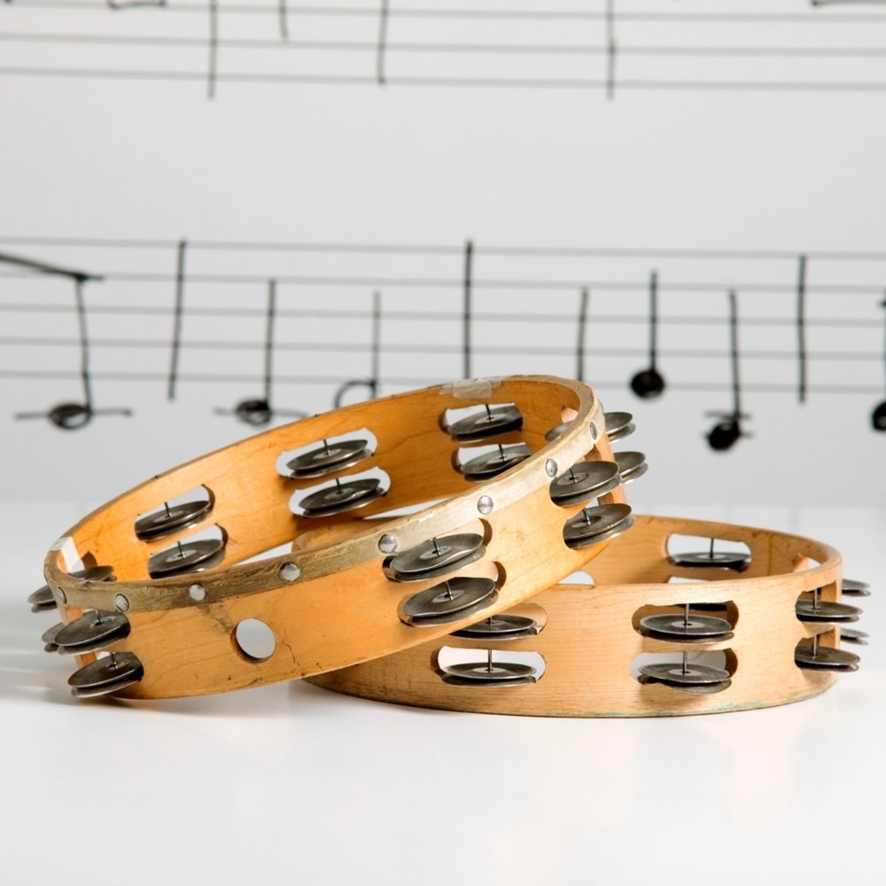 Two wooden tambourine shells with bells
