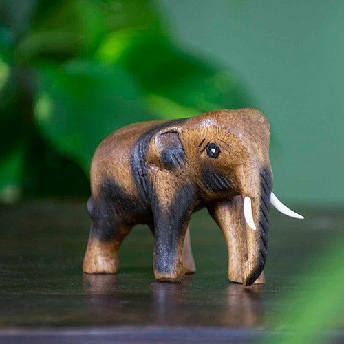 Small wooden carved elephant figurine from Thailand
