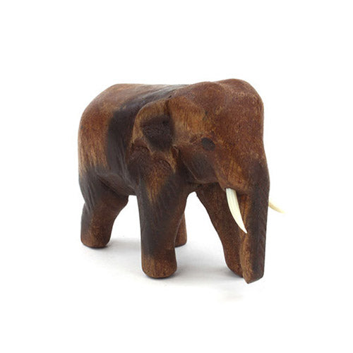 Small wooden carved elephant figurine with white background