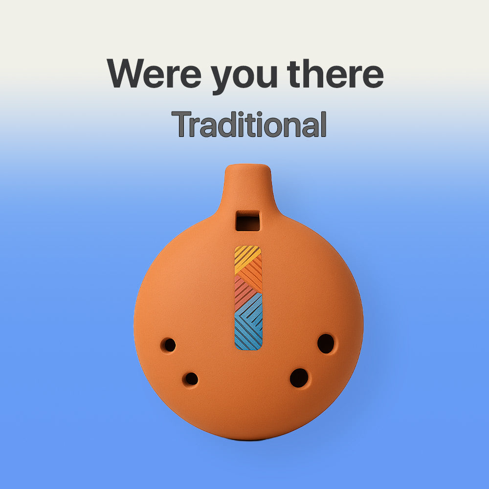 Ceramic ocarina with colorful design on a blue background, text 'Were you there Traditional' above.