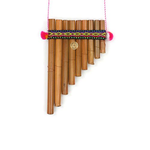 Bamboo pan flute with colorful accents on a white background