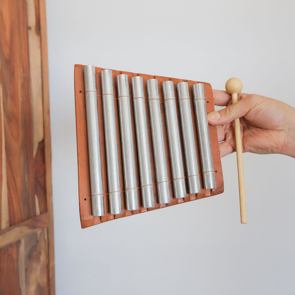 8 note aura chime scale image in hand