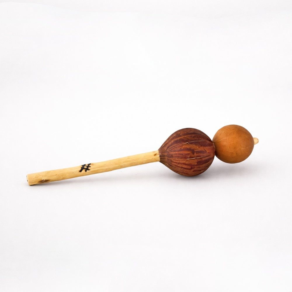Double gourd televi shaker percussion instrument on a white studio background