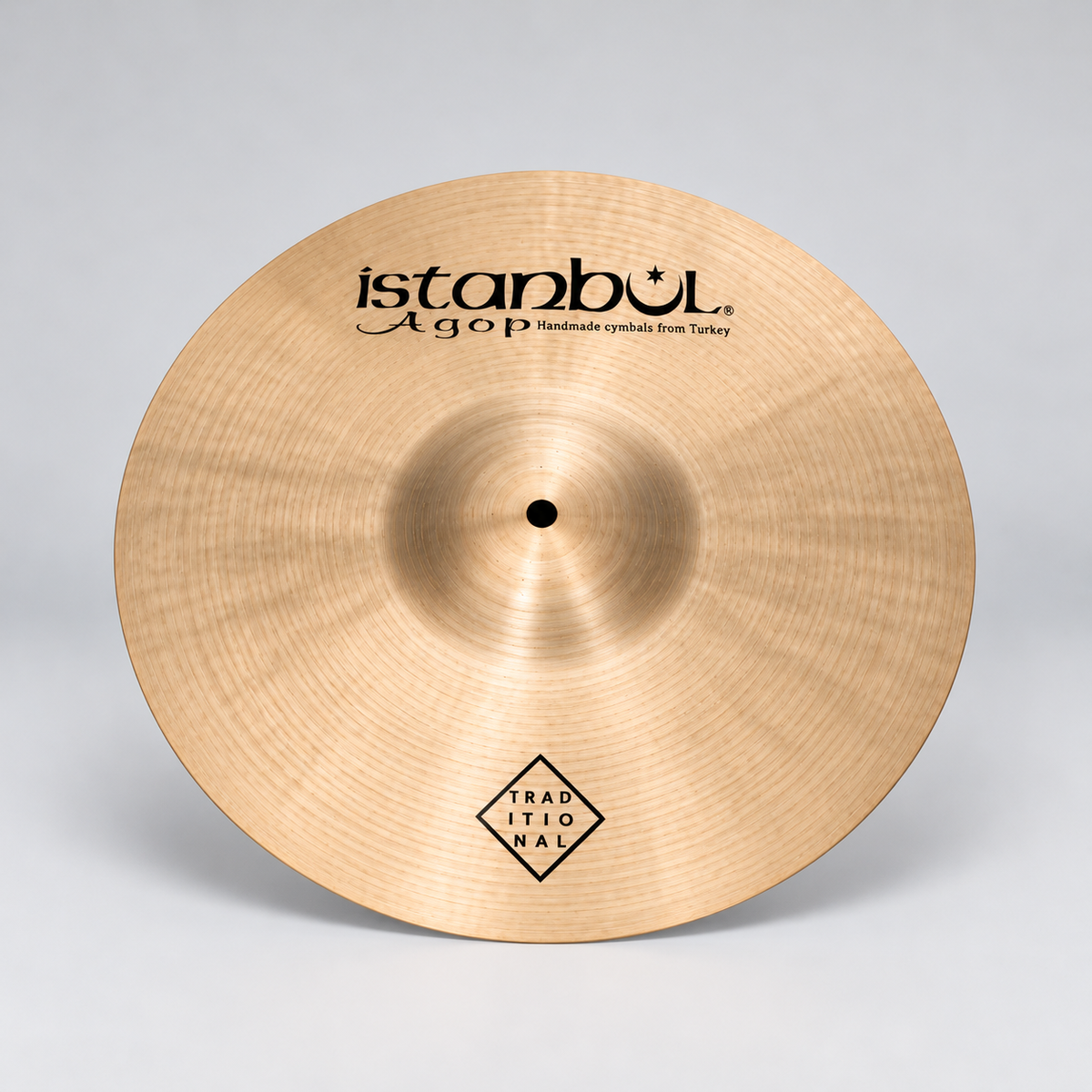 Single Istanbul Agop 10-inch Traditional Bell on light silver-grey background