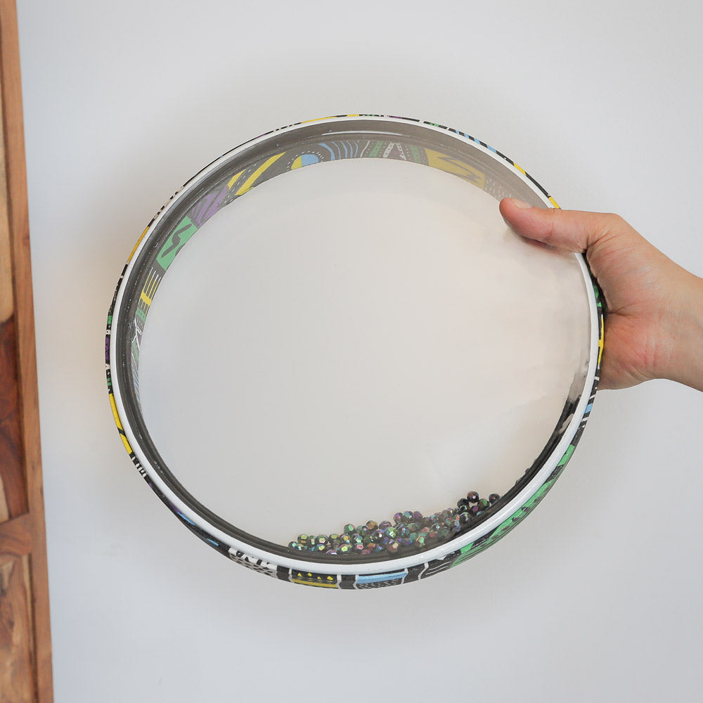 tilted pic ocean drum with beads in hand