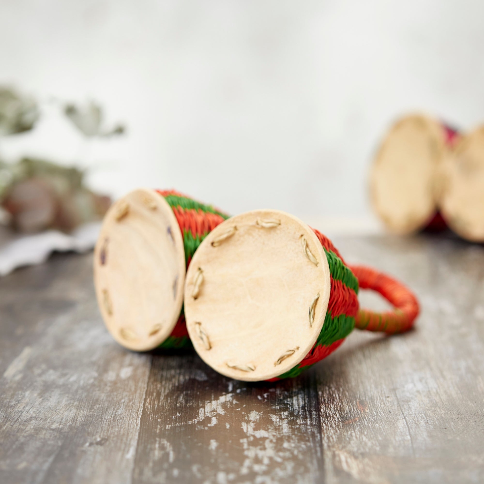 Underneath the double caxixi shaker