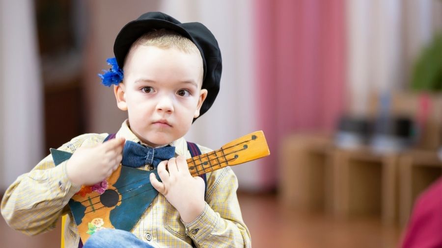 Young boy from Russia playing instrument