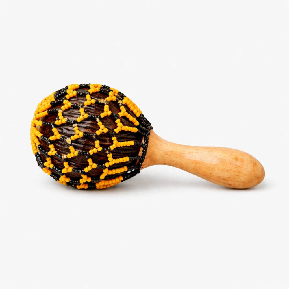 Beaded Satara cabasa rattle shaker with orange and black beads with  wooden handle on a white background
