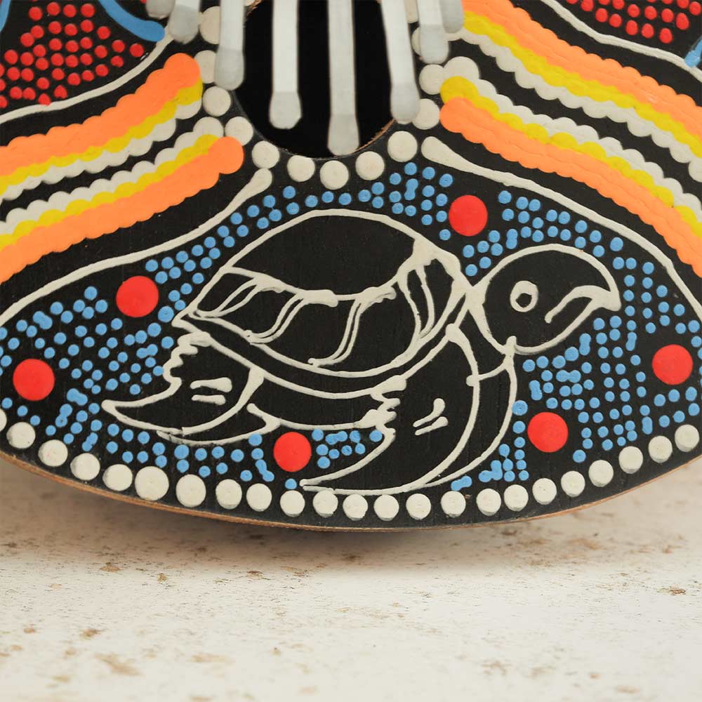 Close up of the hand painted turtle design on the gourd thumb piano instrument