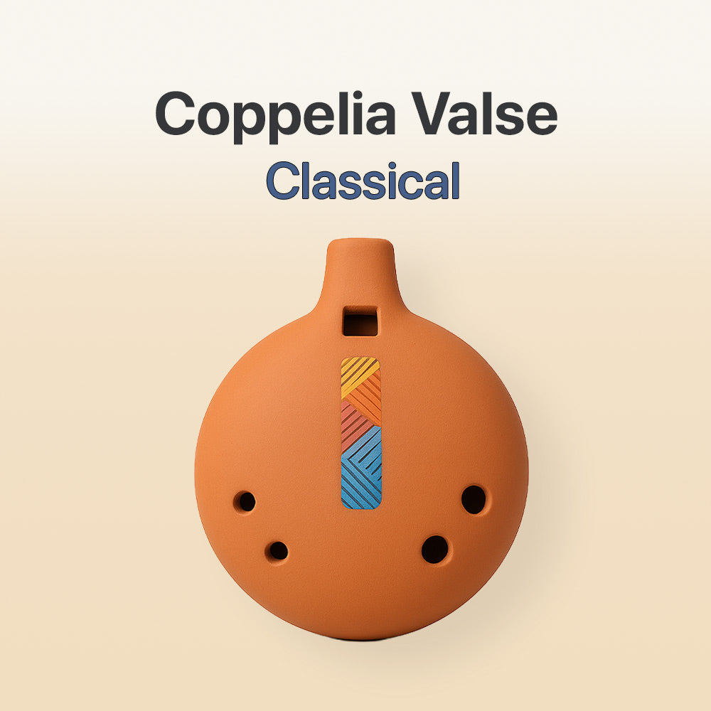 Ceramic ocarina with colorful design on a beige background, labeled 'Coppelia Valse Classical'.