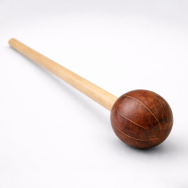 Televi stick shaker with long bamboo handle on a white background