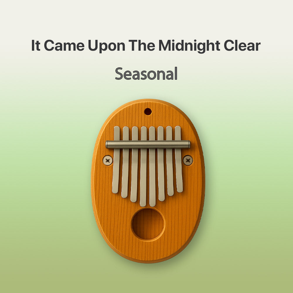 Wooden kalimba on a light green background with text 'It Came Upon The Midnight Clear Seasonal'.