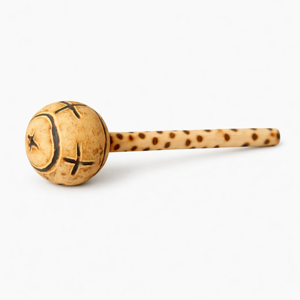 Gourd shaker instrument with tribal carvings and wooden handle
