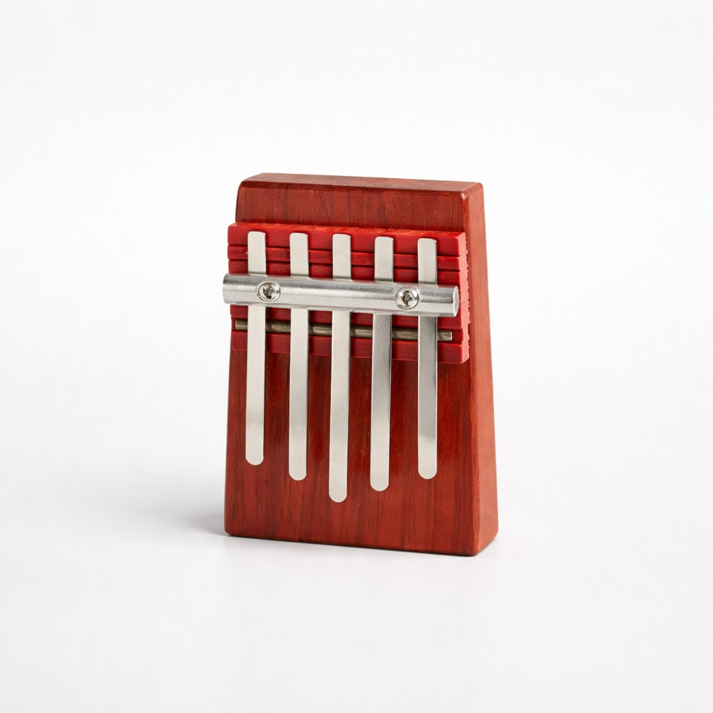 5 Note Wooden kalimba with metal tines on a white studio background