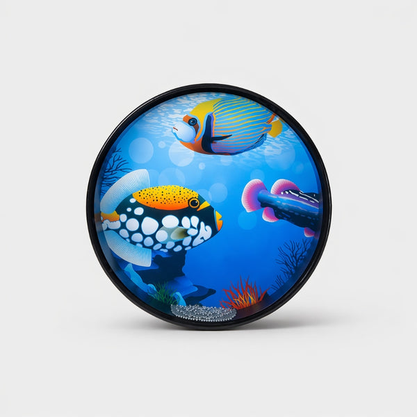 Round ocean drum with tropical fish ocean blue design on a professional studio background
