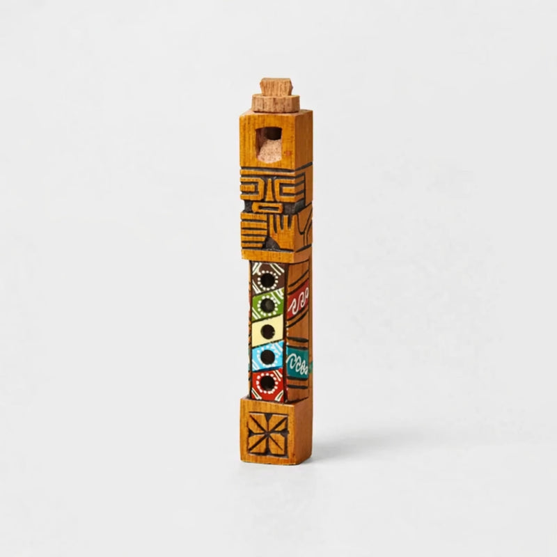 Handcrafted wooden tribal Peruvian Ttarka flute from Peru with colourful design on a white background