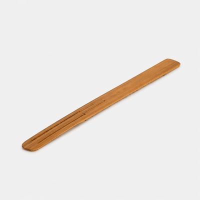 wooden bamboo jaw harp on plain white background 