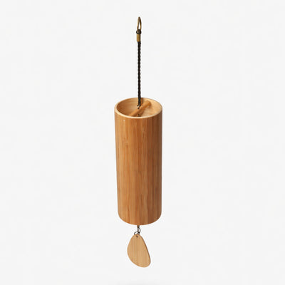 Bamboo hanging Koshi windchime with a leaf-shaped wooden pendant on a white studio background