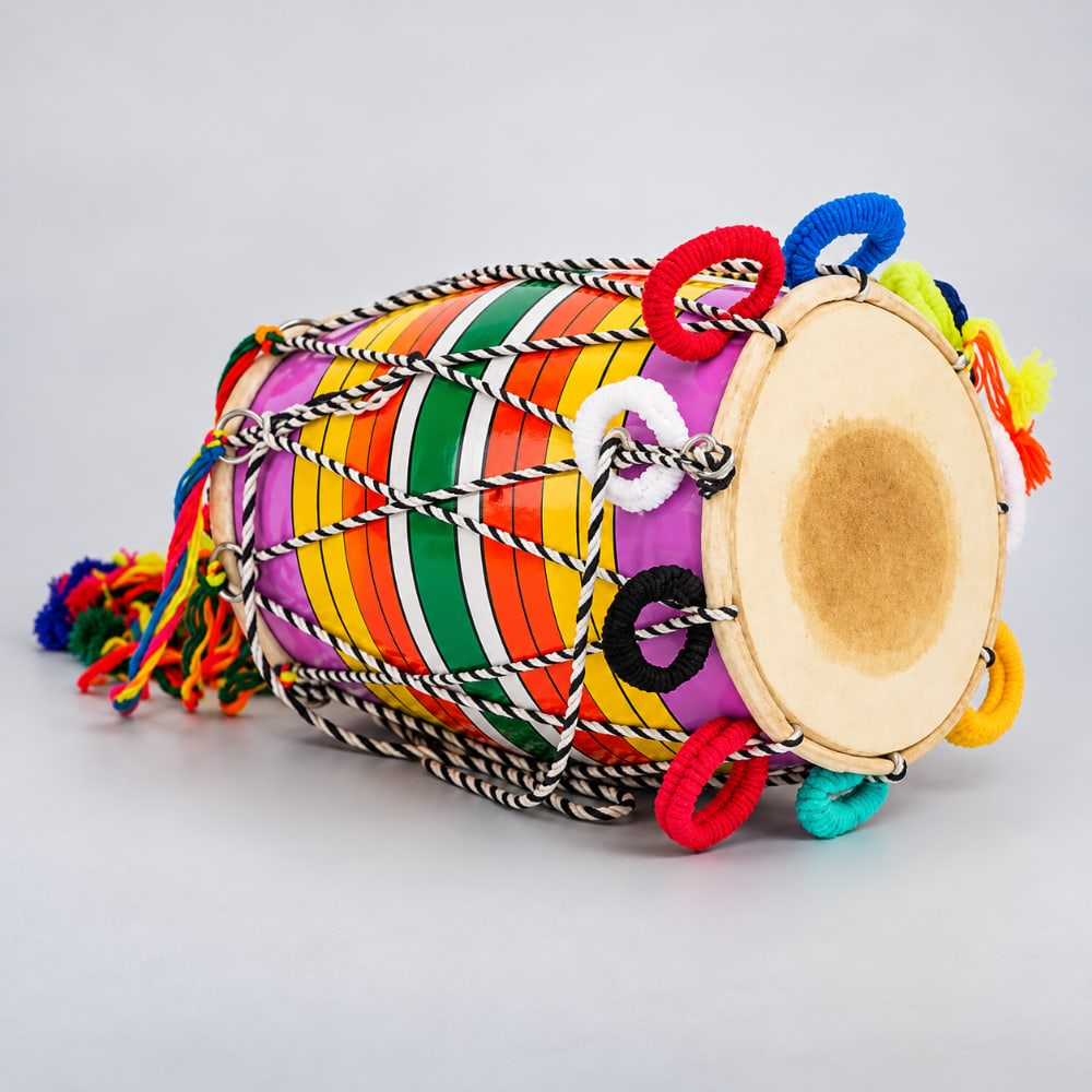 Top side of the traditioanl indian bhangra dhol drum on a light grey studoo background 