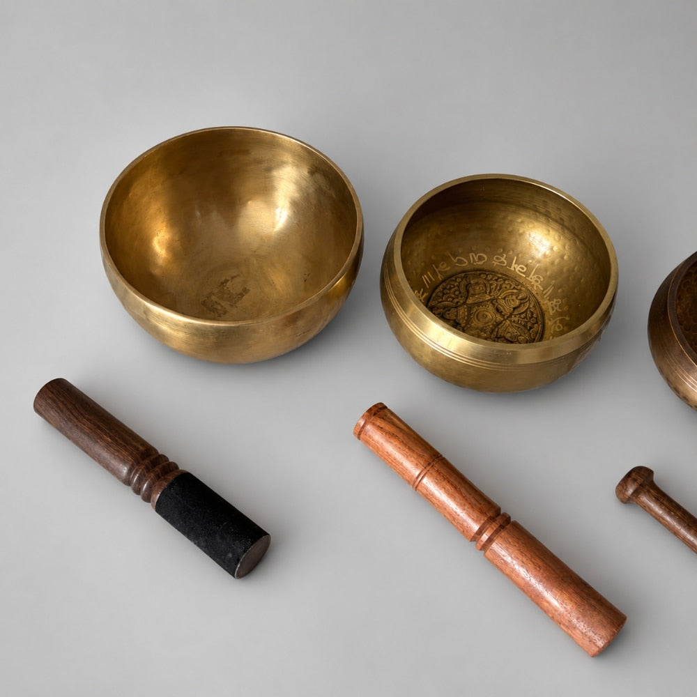 close up of brass singing bowls