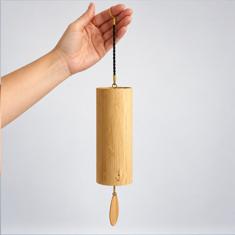 hand holding fire koshi wind chime