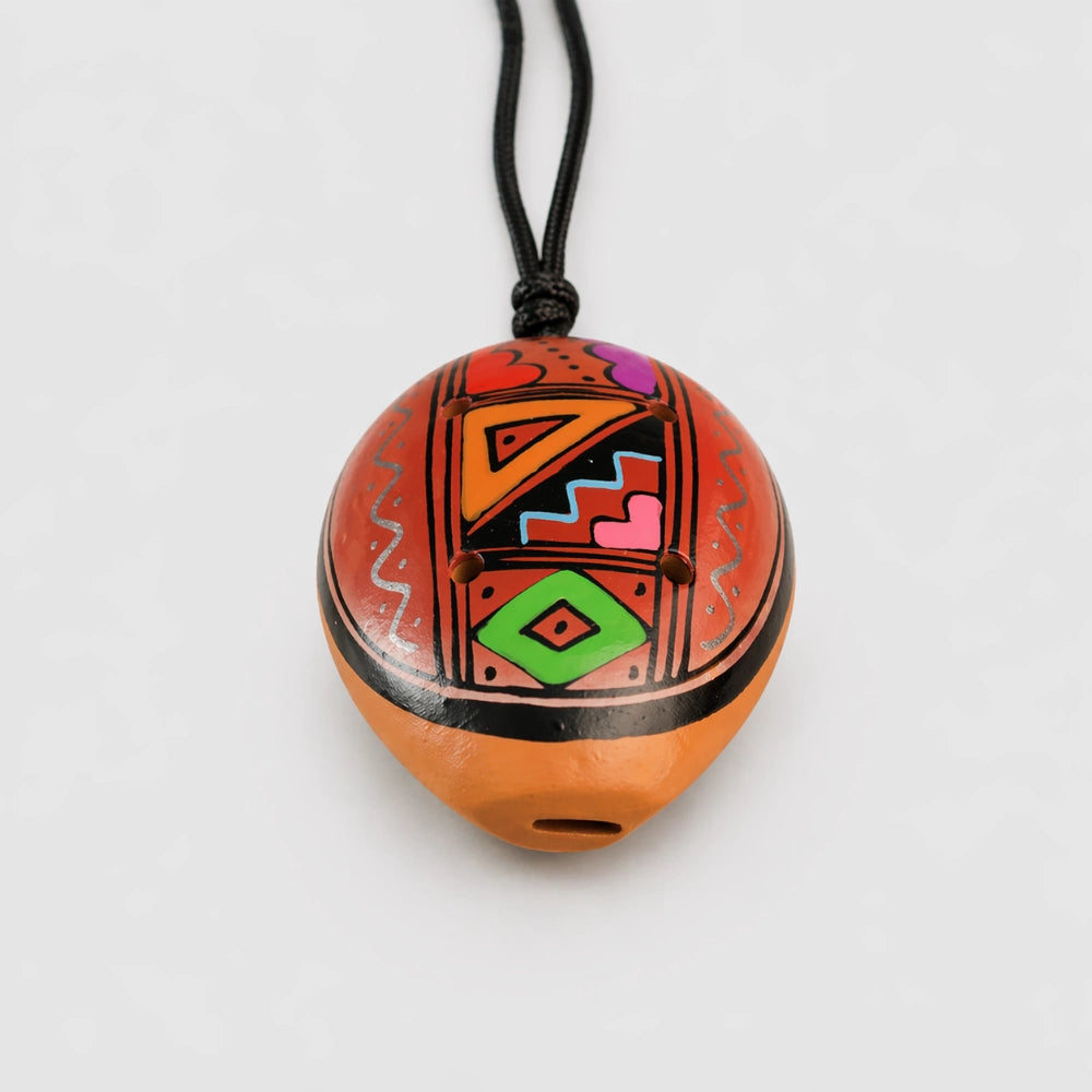 close up of ocarina pendant 