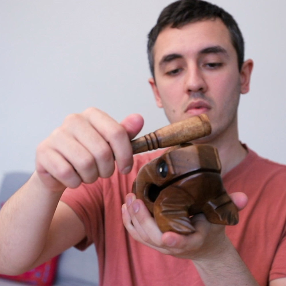 Ryan showing how to play the croaking frog guiro