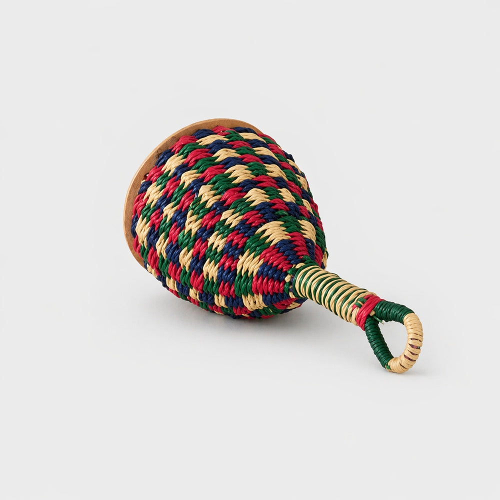 colourful caxixi shaker on grey background 