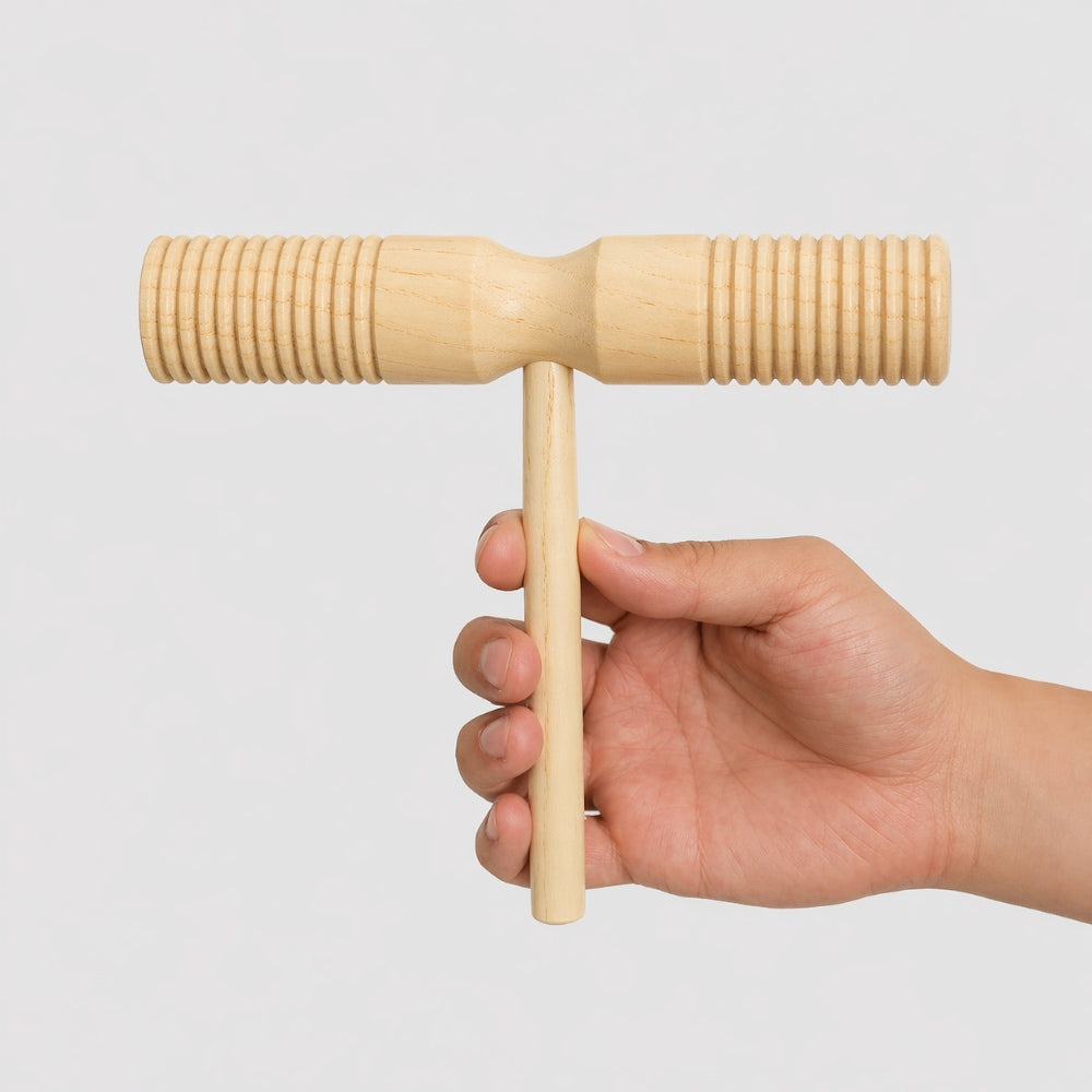 hand holding T shape guiro tone block 